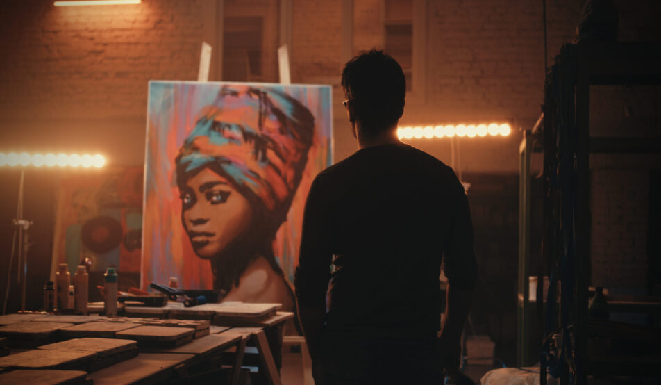 artist-standing-in-studio-viewing-portrait-paintin-2026-09-25-02-22-04-utc